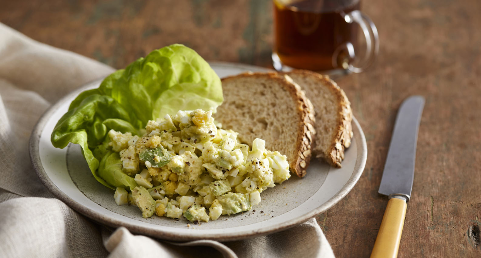 Avocado egg salad with bread and lettuce