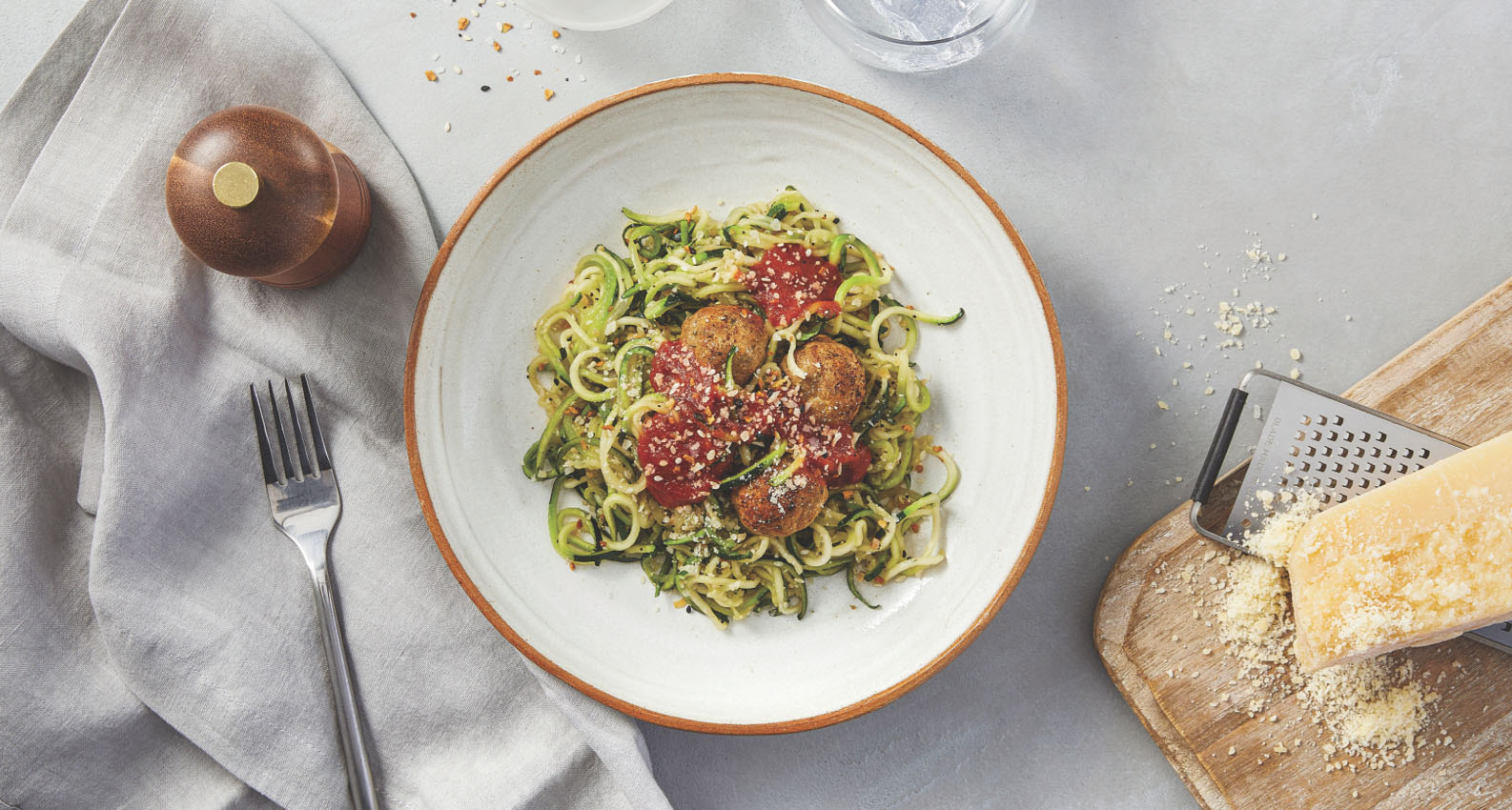 A plate of zoodles with turkey meatballs