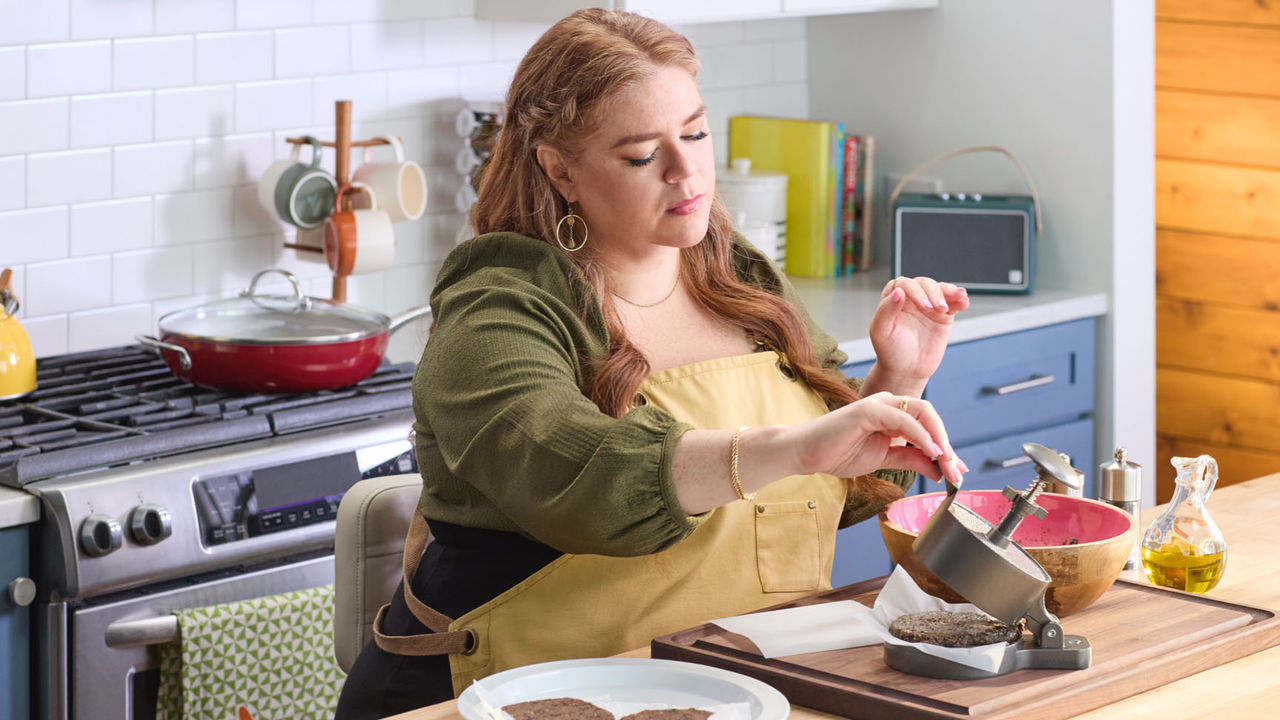 Alicia using a patty press
