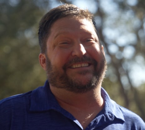 Portrait of Chris smiling outside Portrait of Chris smiling outside